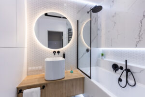 Modern small bathroom showcasing light colors, an example of bathroom remodeling services.